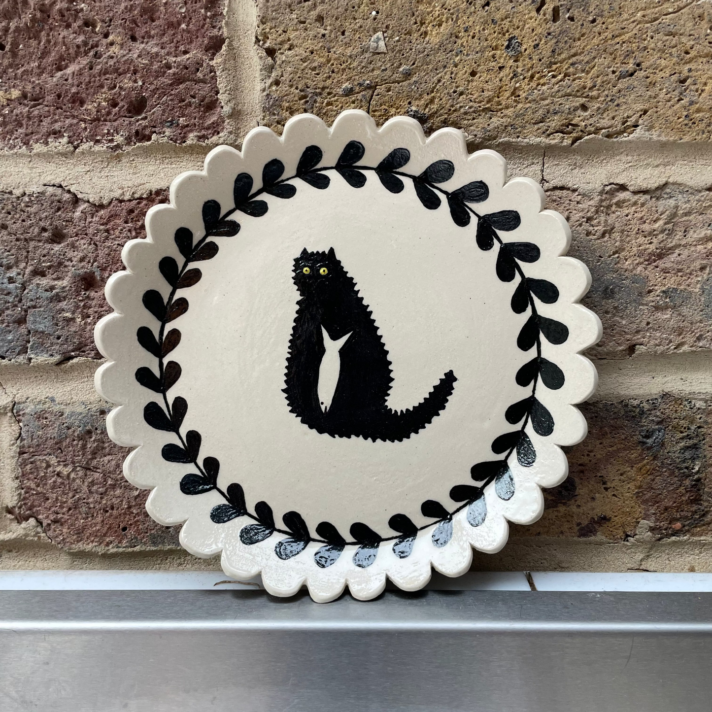 Handmade ceramic plate with hand-painted cat design