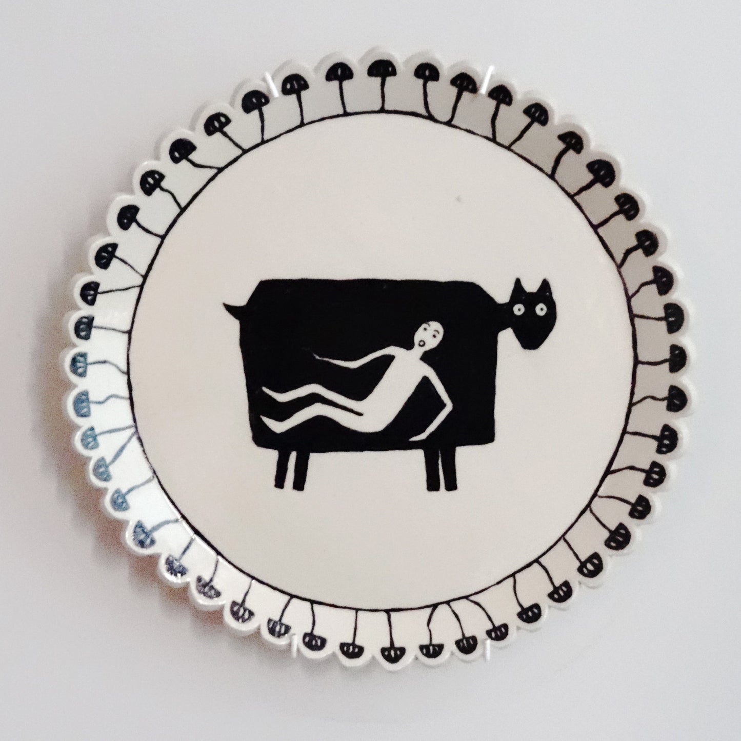 Handmade ceramic plate with hand-painted cow design