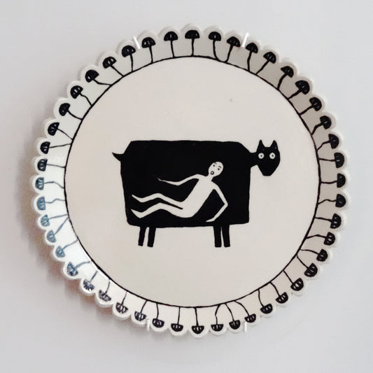 Handmade ceramic plate with hand-painted cow design