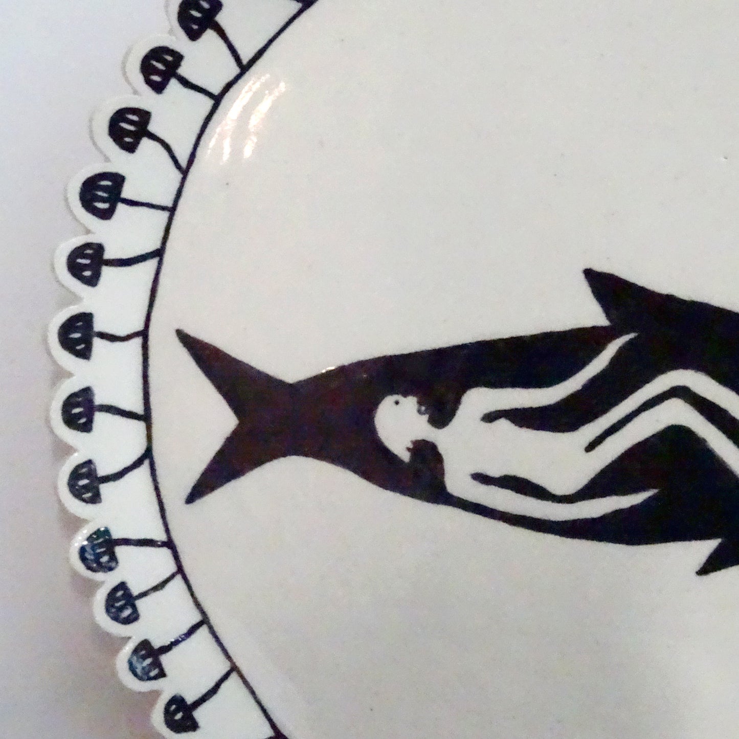 Handmade ceramic plate with hand-painted fish design