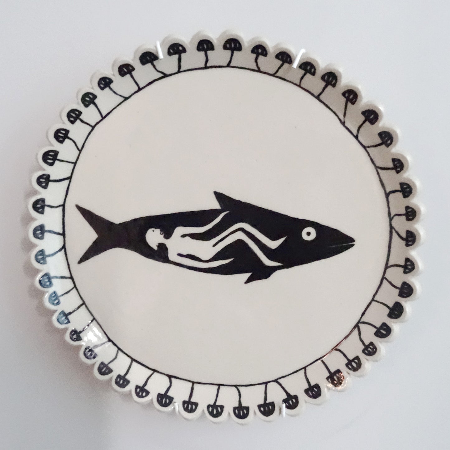 Handmade ceramic plate with hand-painted fish design